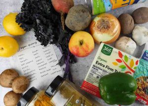 Vegan grocery shopping list and fresh fruits and veggies