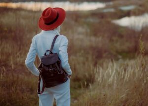 Hiker wearing a brown leather vegan backpack